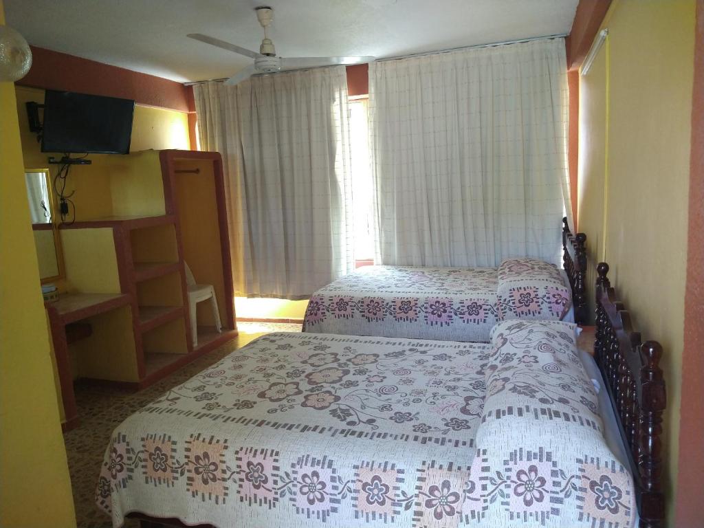 Letto o letti in una camera di Hotel Olimar