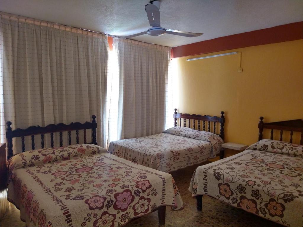 Letto o letti in una camera di Hotel Olimar