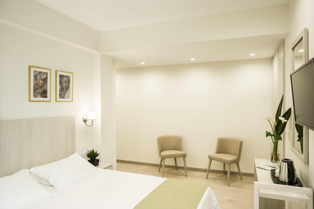 TV a/nebo společenská místnost v ubytování Roseum Boutique Hotel