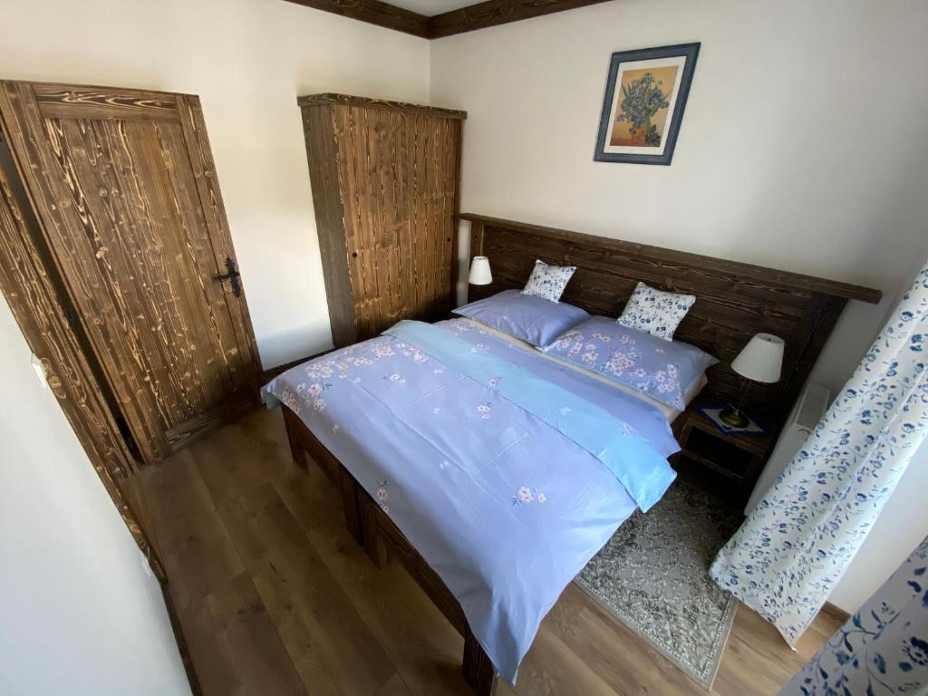 Postel nebo postele na pokoji v ubytování Apartmány Veternica v Bernarde