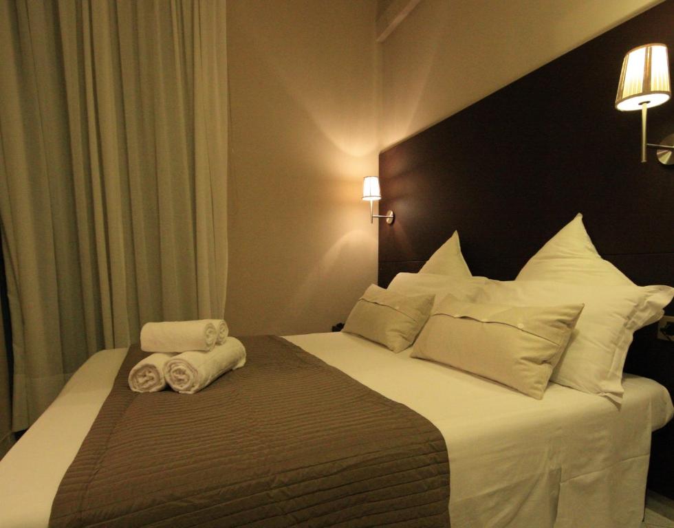 Postel nebo postele na pokoji v ubytování Hotel Felice