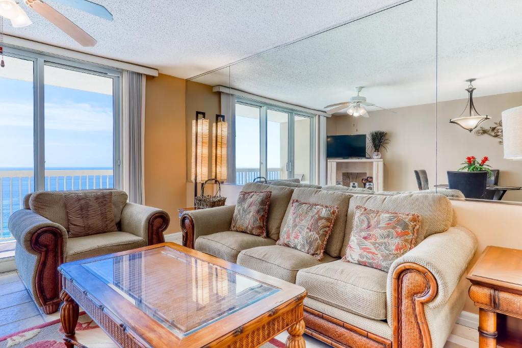 a living room with a couch and a table at Pelican Pointe in Destin