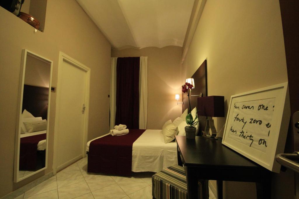 Postel nebo postele na pokoji v ubytování Hotel Felice