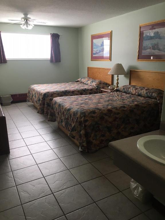 Postel nebo postele na pokoji v ubytování Almada Inn