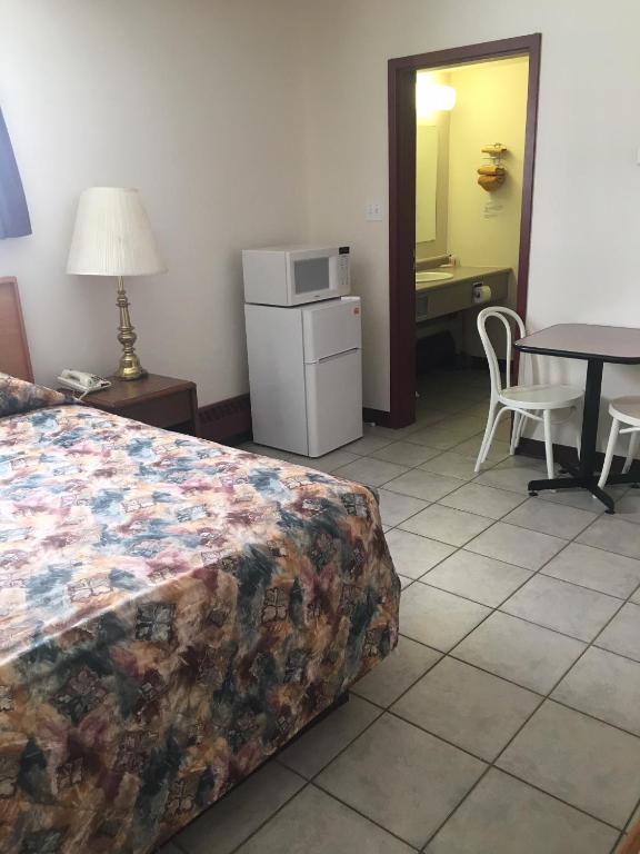 Postel nebo postele na pokoji v ubytování Almada Inn