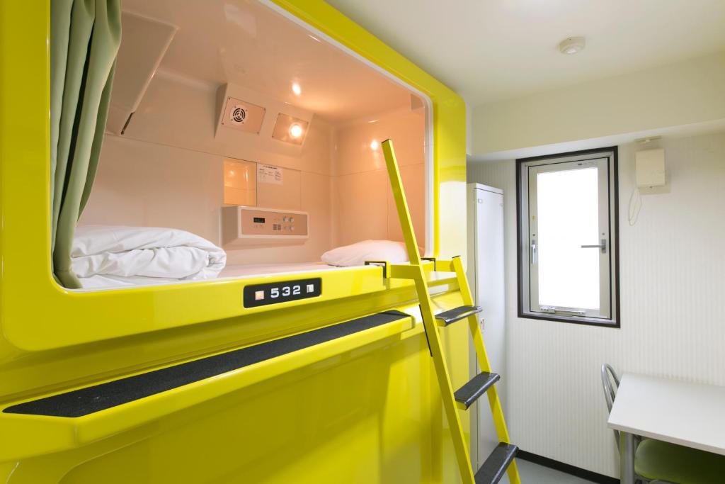 Postel nebo postele na pokoji v ubytování Hotel Shin-Imamiya