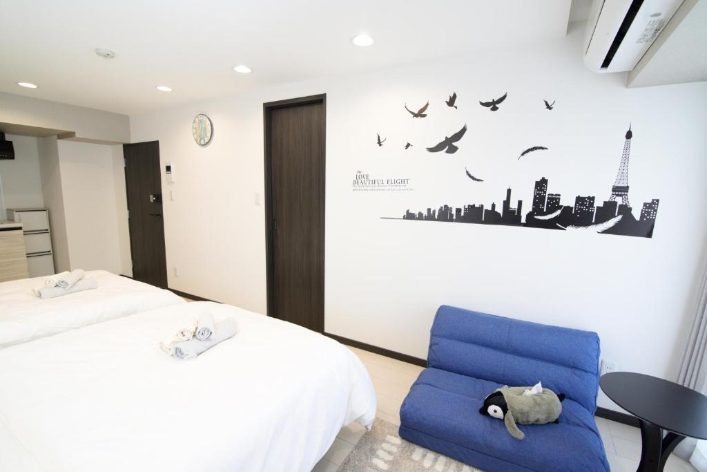 Postel nebo postele na pokoji v ubytování Hotel Central Yokohama