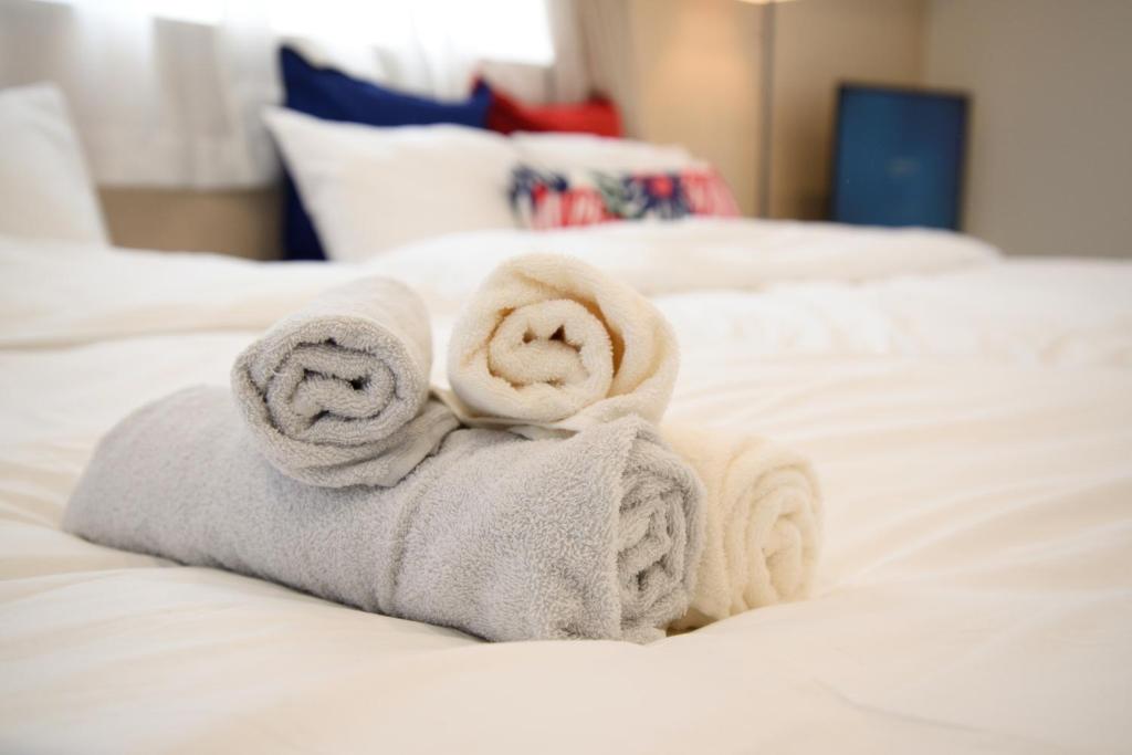 Postel nebo postele na pokoji v ubytování Hotel Central Yokohama