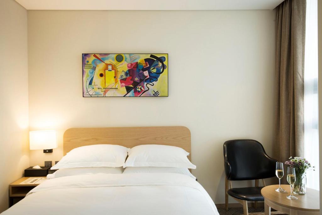 Postel nebo postele na pokoji v ubytování Best Western Haeundae Hotel