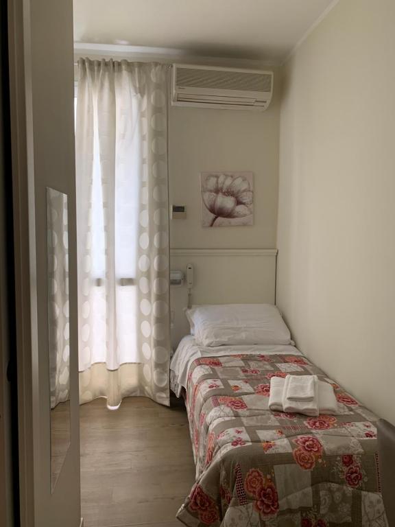 Postel nebo postele na pokoji v ubytování Hotel Villa Edda