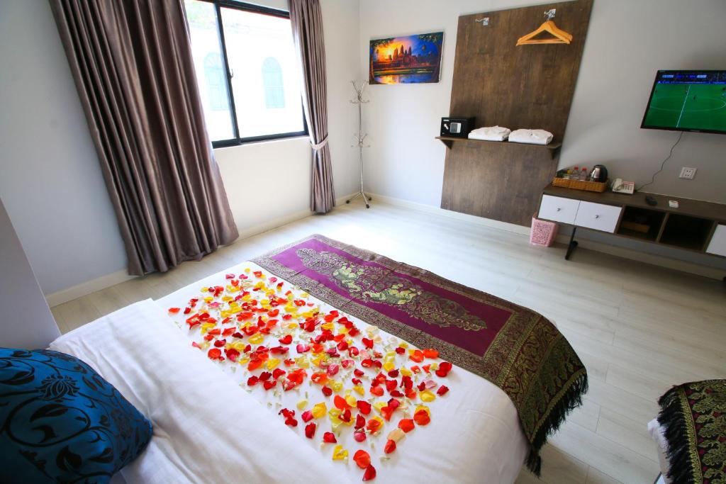 Postel nebo postele na pokoji v ubytování Ostro Hotel