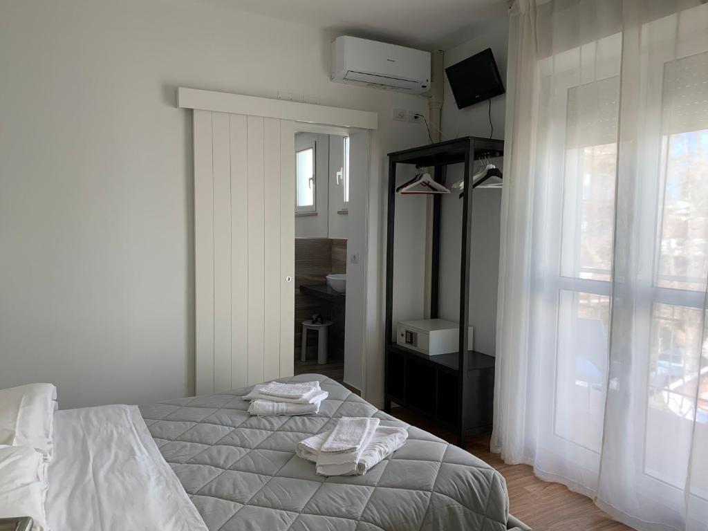 Postel nebo postele na pokoji v ubytování Hotel Villa Edda