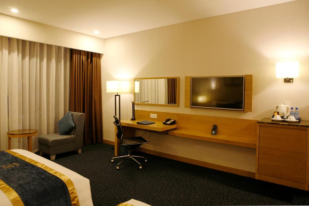 TV a/nebo společenská místnost v ubytování Ciao SaiGon Hotel & Spa