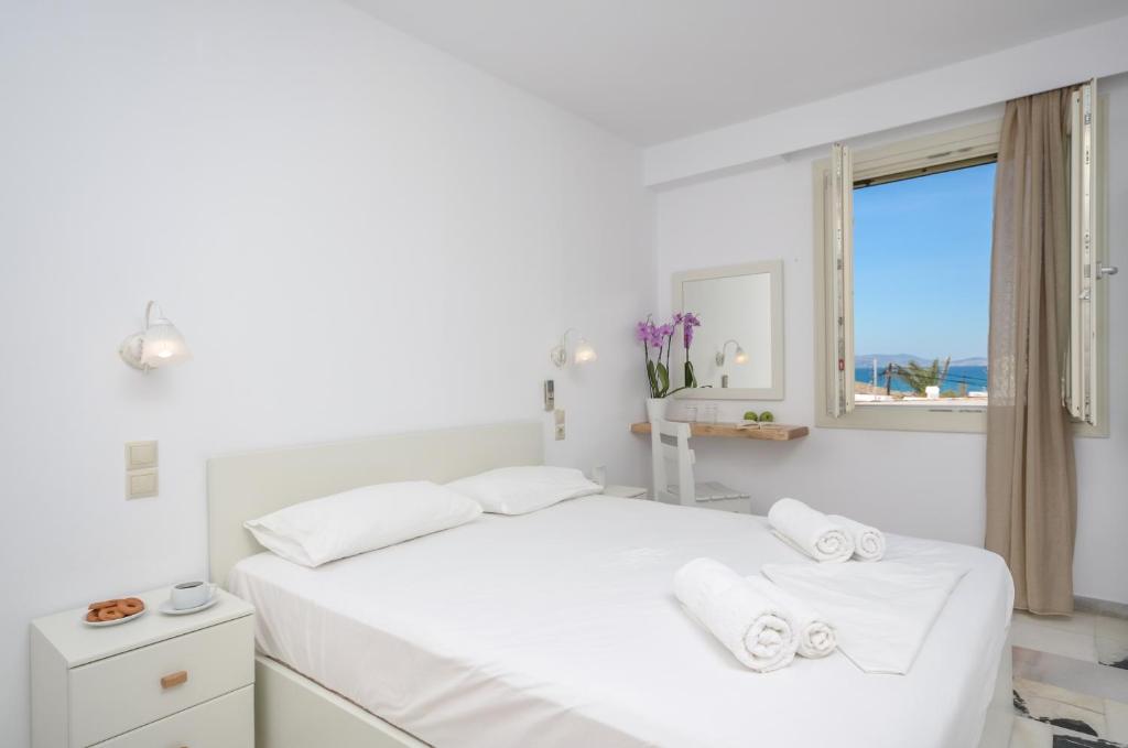 A bed or beds in a room at Soula Naxos
