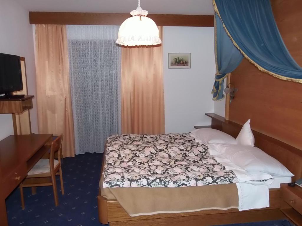 Postel nebo postele na pokoji v ubytování Hotel Pausa