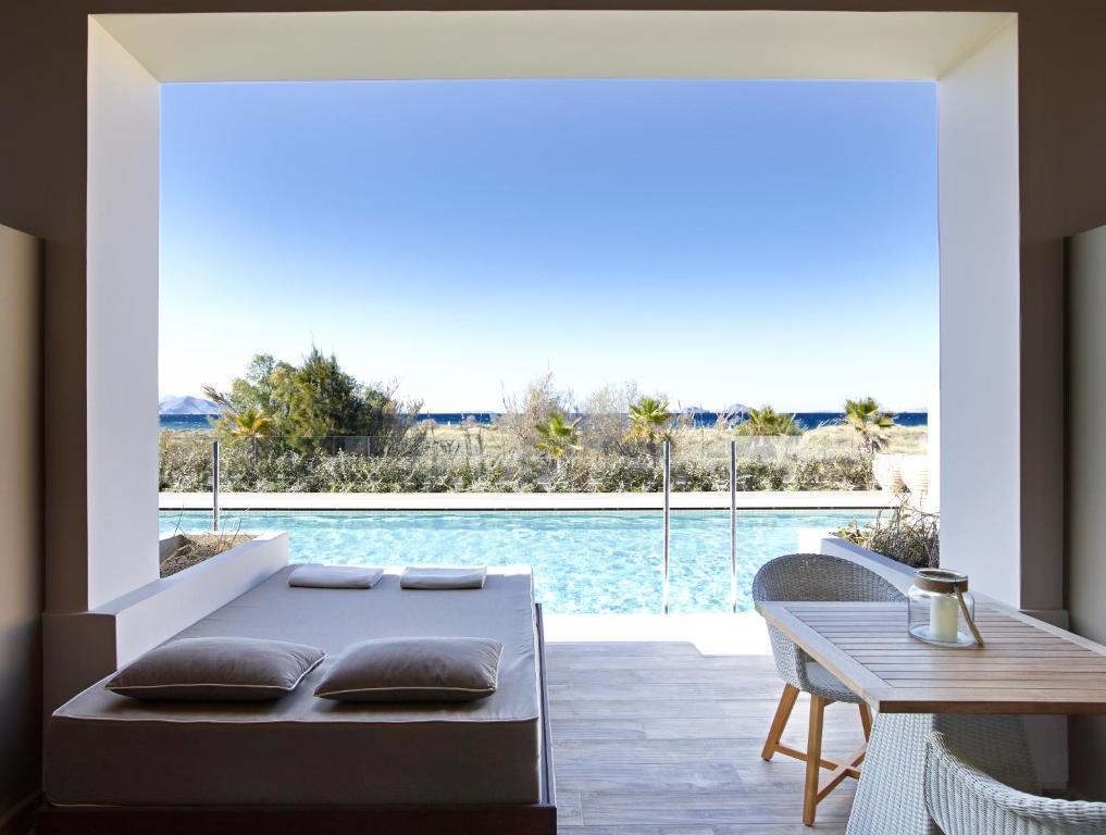 The swimming pool at or close to Pelagos Suites Hotel & Spa