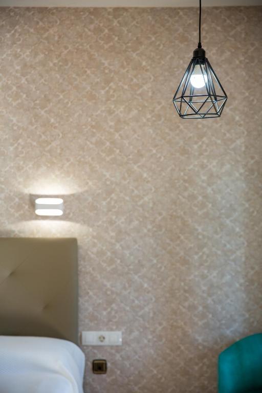 Łóżko lub łóżka w pokoju w obiekcie Hostal Don Joaquín Alora