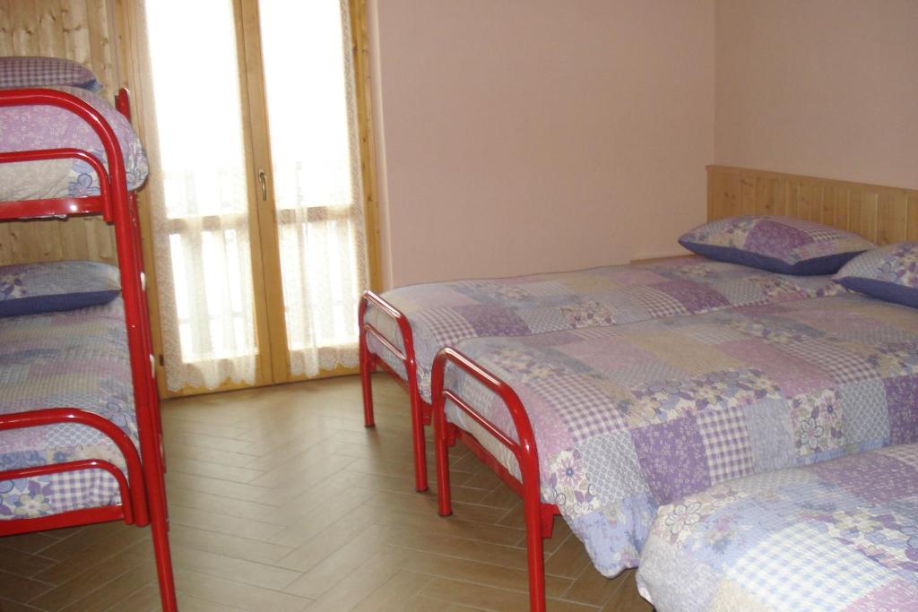 Letto o letti in una camera di Rifugio Alpe Ponte