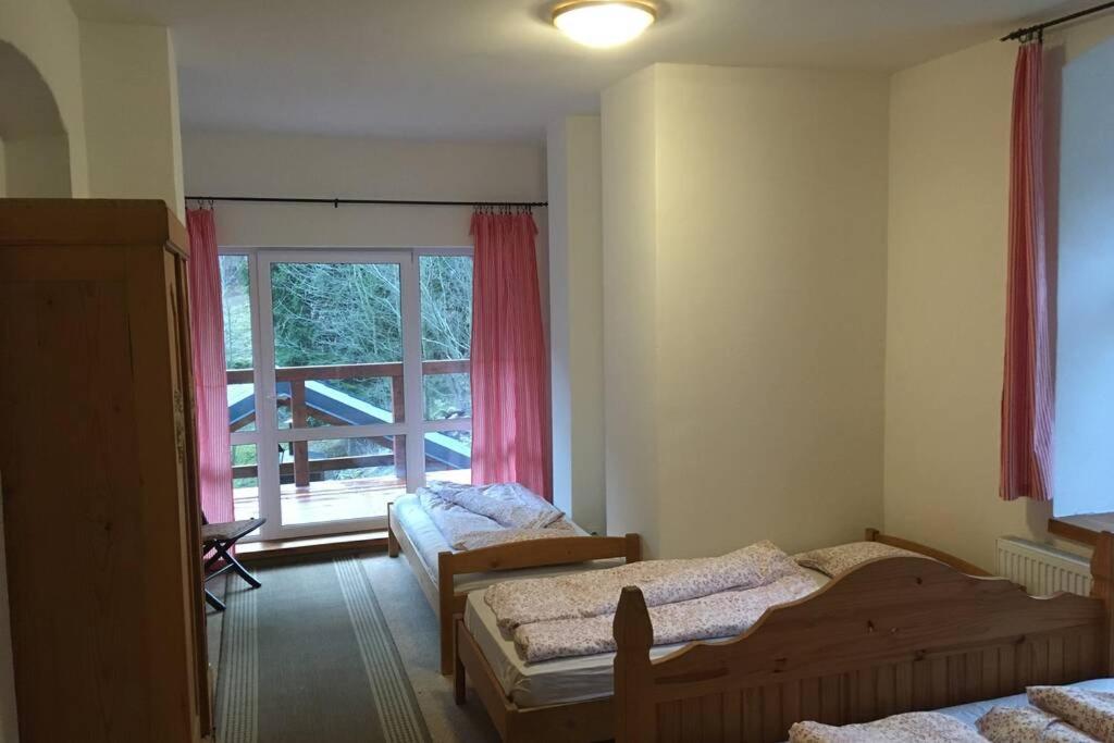 Postel nebo postele na pokoji v ubytování Villa Vykmanov