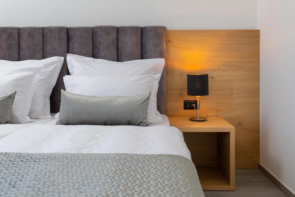 Postel nebo postele na pokoji v ubytování Fontevita Apartments