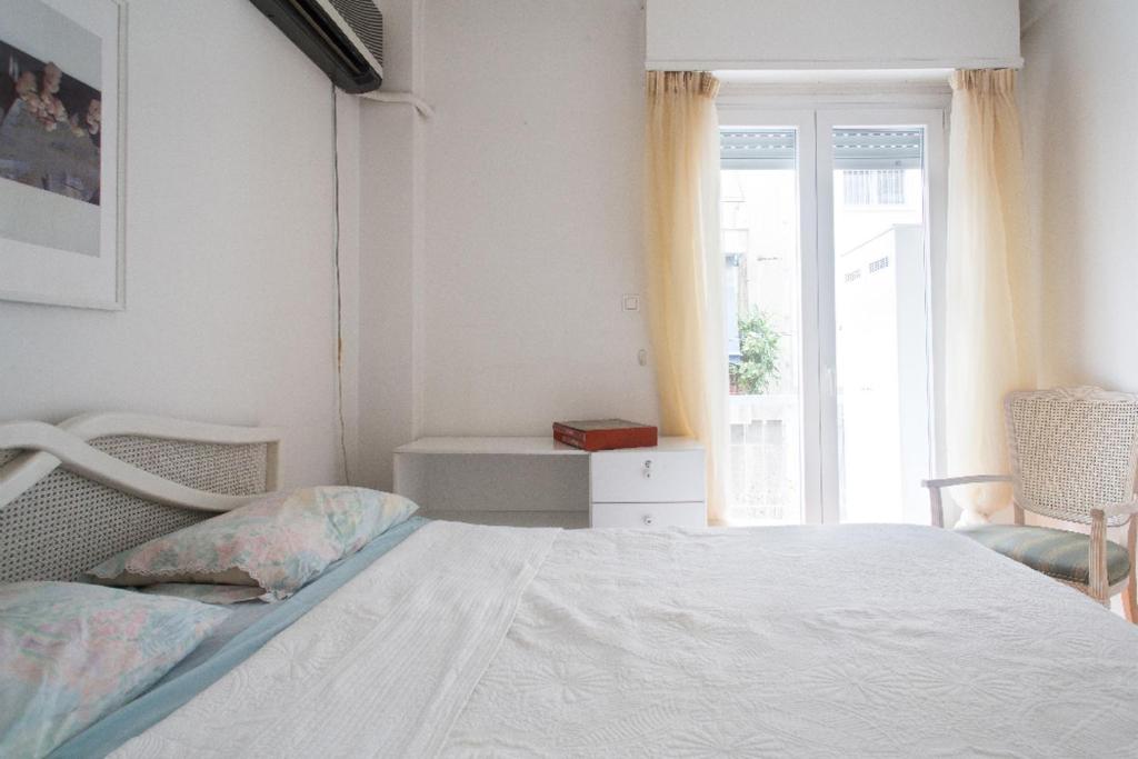 A bed or beds in a room at Flat in central Athens - Pangrati