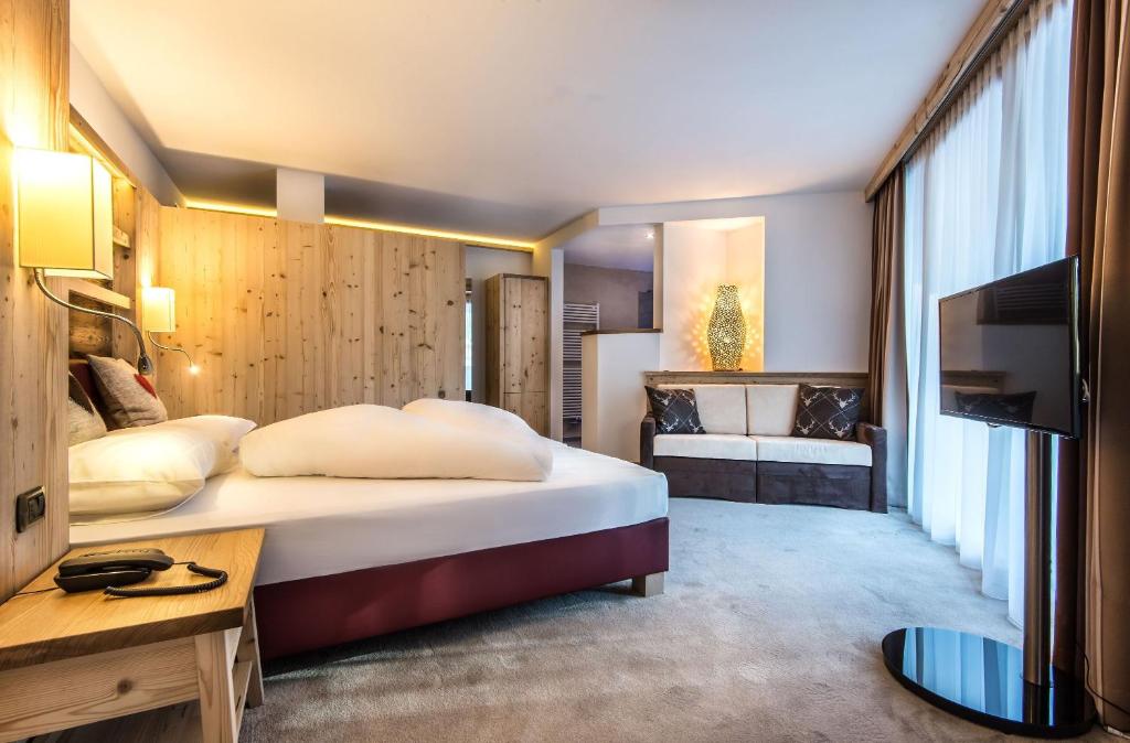 Postel nebo postele na pokoji v ubytování Albergo Posta Pederoa