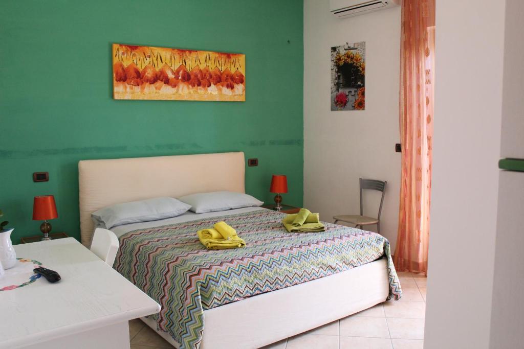 Postel nebo postele na pokoji v ubytování B&B L'amicizia