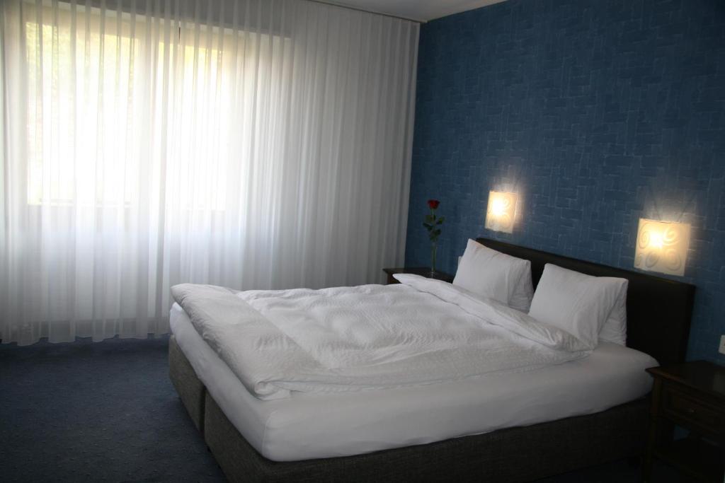 Postelja oz. postelje v sobi nastanitve Hotel Eremitage