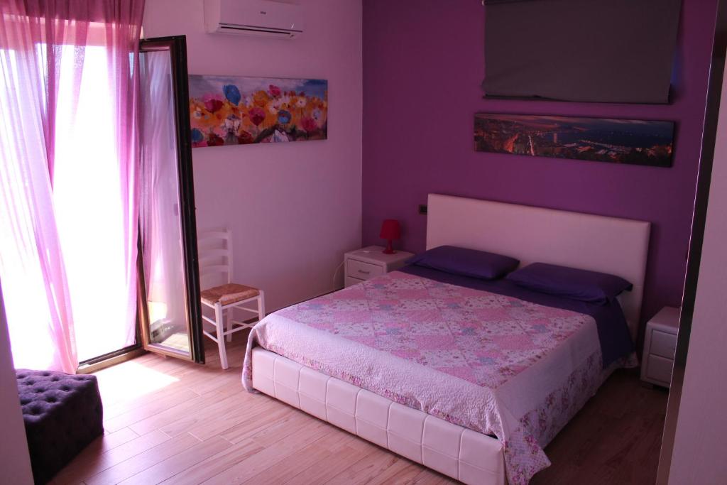 Postel nebo postele na pokoji v ubytování B&B L'amicizia