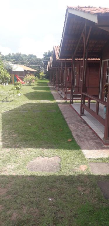 a row of houses with grass in front of them at CHALES AABB SALVADOR(BA) in Salvador