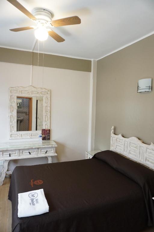 Postel nebo postele na pokoji v ubytování Hotel Palacio