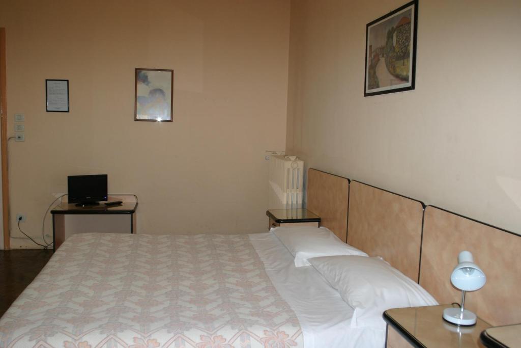 Łóżko lub łóżka w pokoju w obiekcie Hotel Panorama Bologna Centro