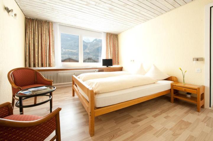 Postel nebo postele na pokoji v ubytování Das Hotel Sherlock Holmes