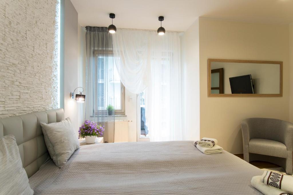 Posteľ alebo postele v izbe v ubytovaní Prestige Apartamenty Stara Polana & SPA2