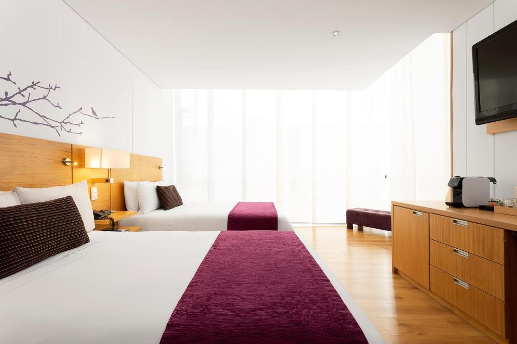 Postel nebo postele na pokoji v ubytování Hotel bh Parque 93