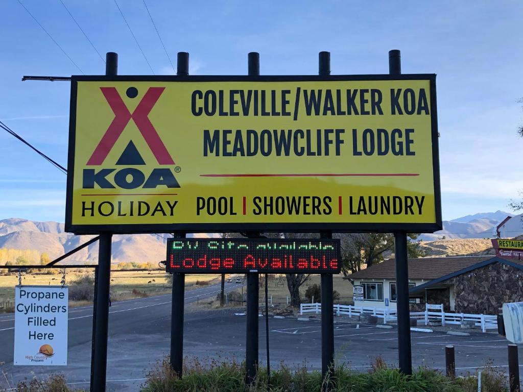 a sign for akwinylka meadow utility lodge at Meadowcliff Lodge Coleville in Coleville