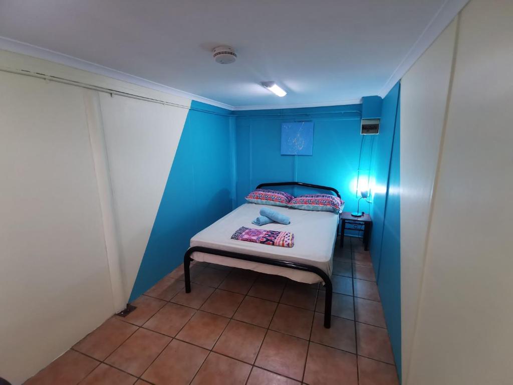A bed or beds in a room at Darwin Hostel