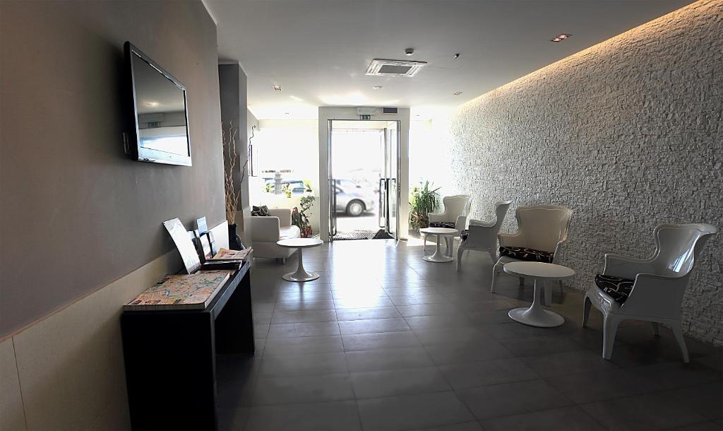 TV a/nebo společenská místnost v ubytování Hotel La Scaletta