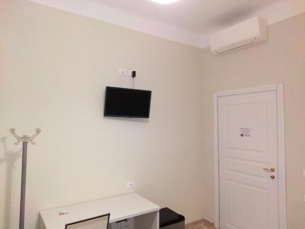Telewizja i/lub zestaw kina domowego w obiekcie Hotel Emmy