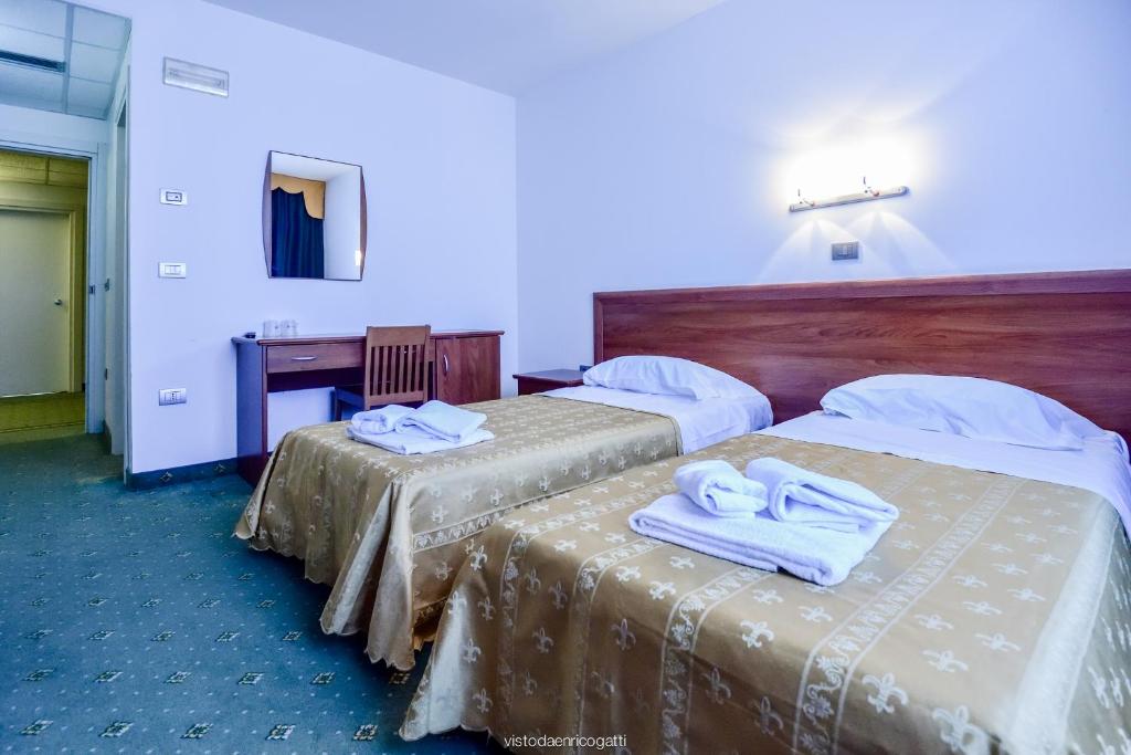 Postel nebo postele na pokoji v ubytování Standard Hotel Udine