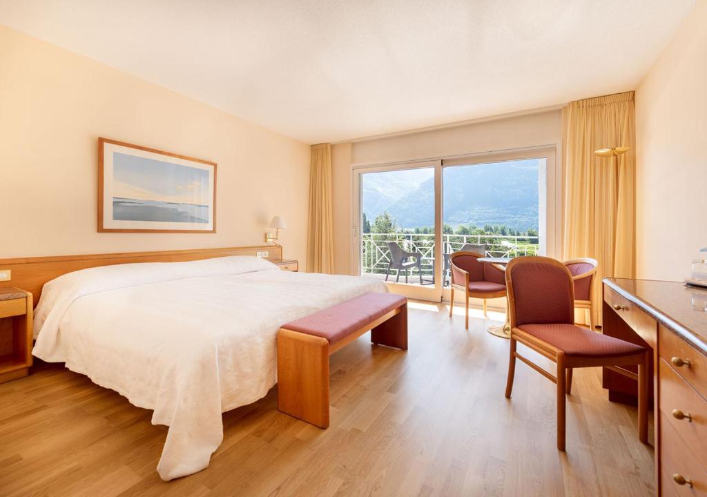 Postel nebo postele na pokoji v ubytování Hôtel des Bains de Saillon