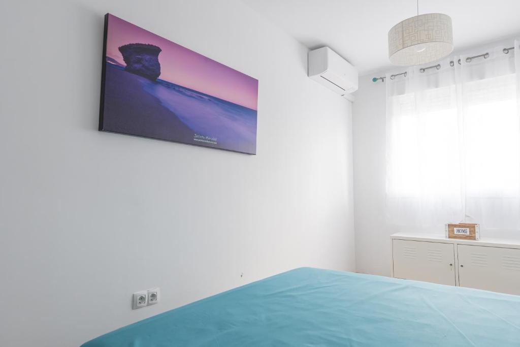 A bed or beds in a room at Casa Elena - Cabo de Gata