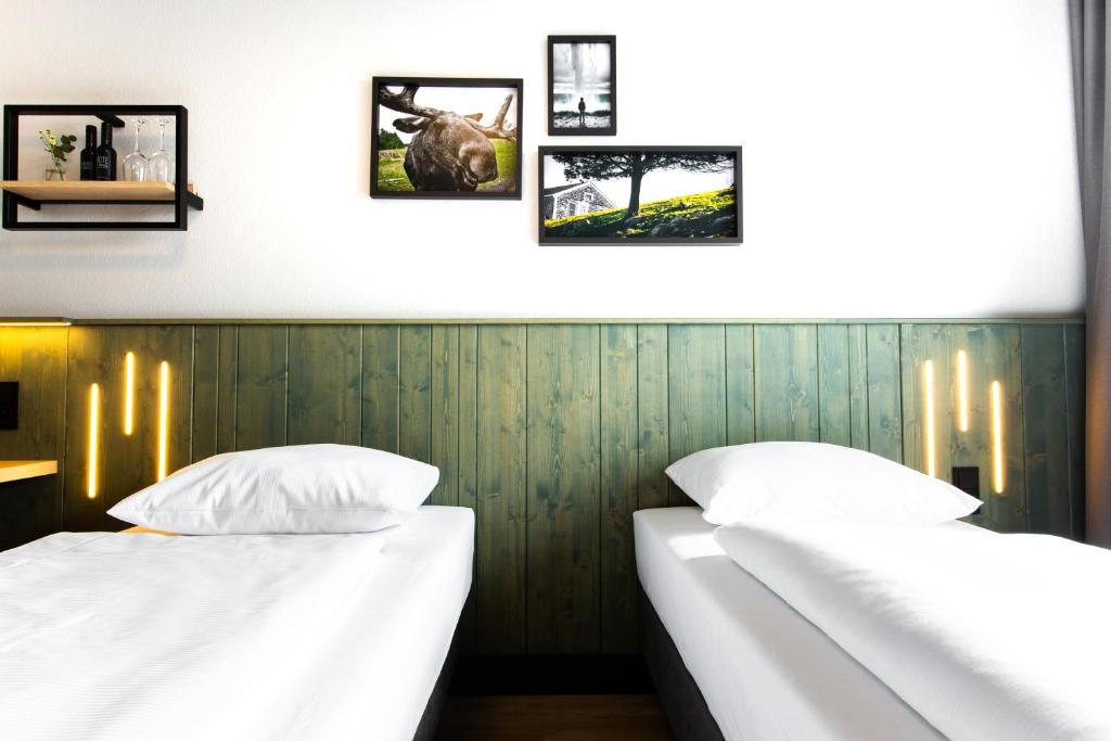 Postel nebo postele na pokoji v ubytování fjord hotel berlin