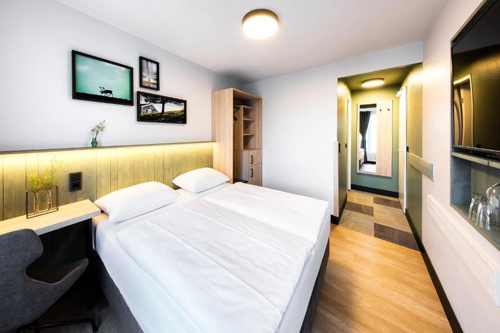 Postel nebo postele na pokoji v ubytování fjord hotel berlin