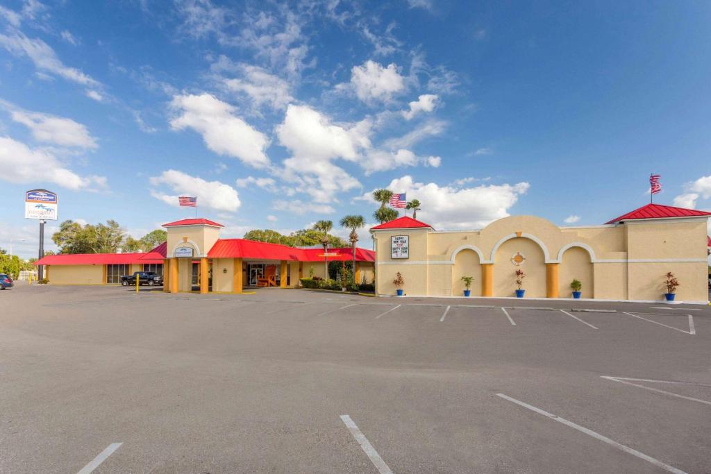 a parking lot in front of a gas station at Howard Johnson by Wyndham Lakeland in Lakeland
