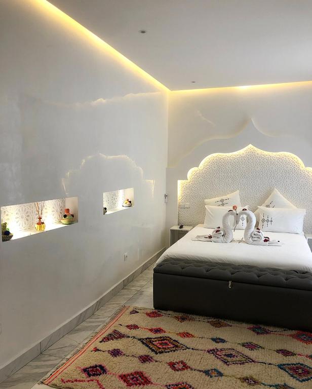 Postel nebo postele na pokoji v ubytování RIAD NOLITA & SPA Kasbah