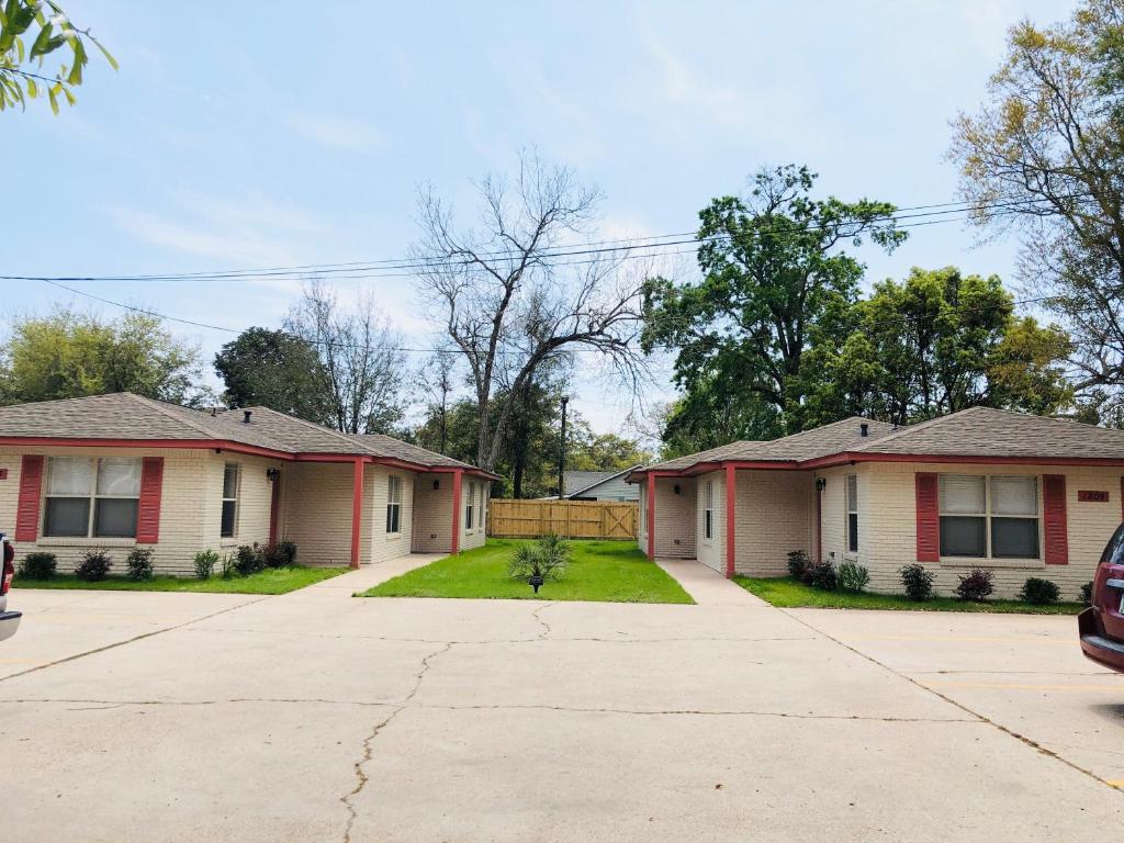 a pair of houses with a driveway at Villas at Valencia Bay in Gulfport