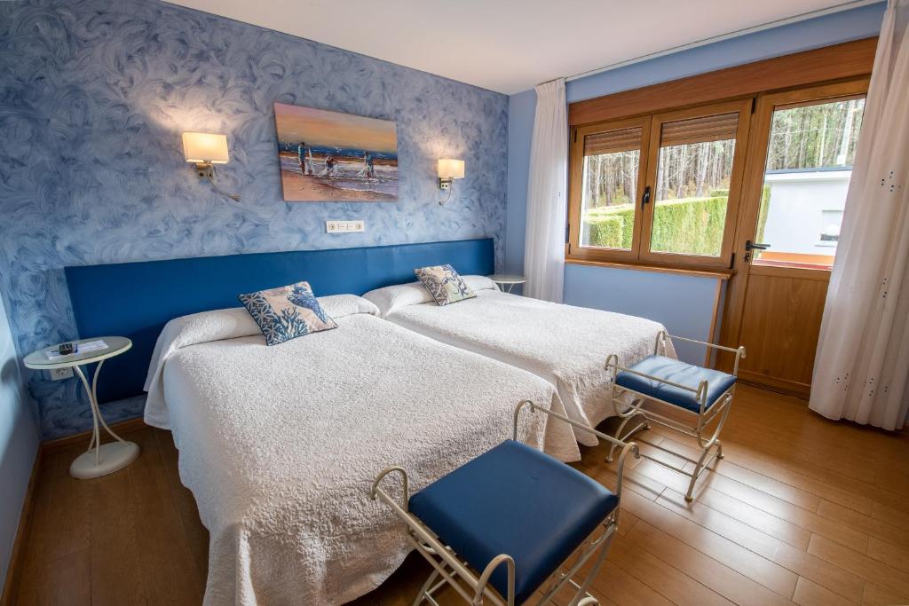 A bed or beds in a room at Hotel el Pinar