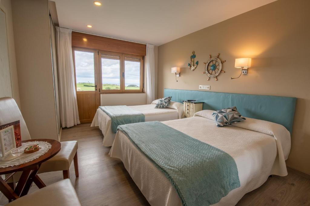 A bed or beds in a room at Hotel el Pinar