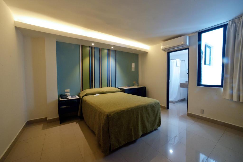 Postel nebo postele na pokoji v ubytování Hotel Mar y Tierra
